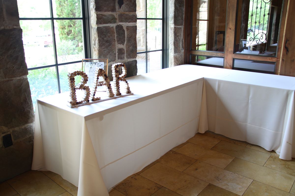90x132 Ivory Solid Tablecovers on 6'x30" Tables